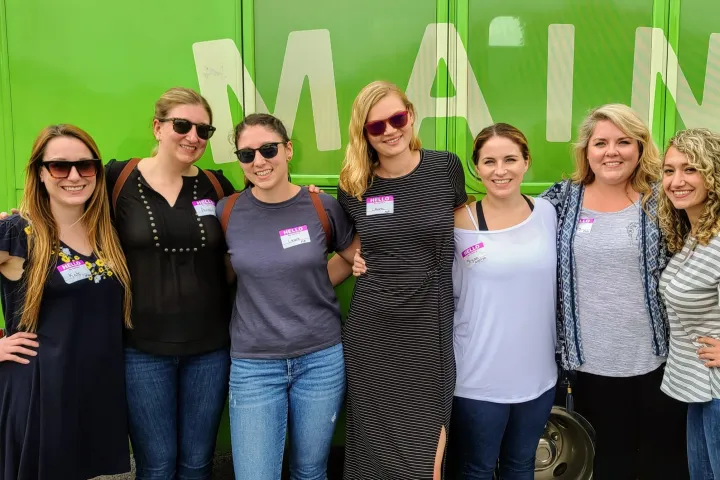 Kelly Alexander et al. posing for a photo