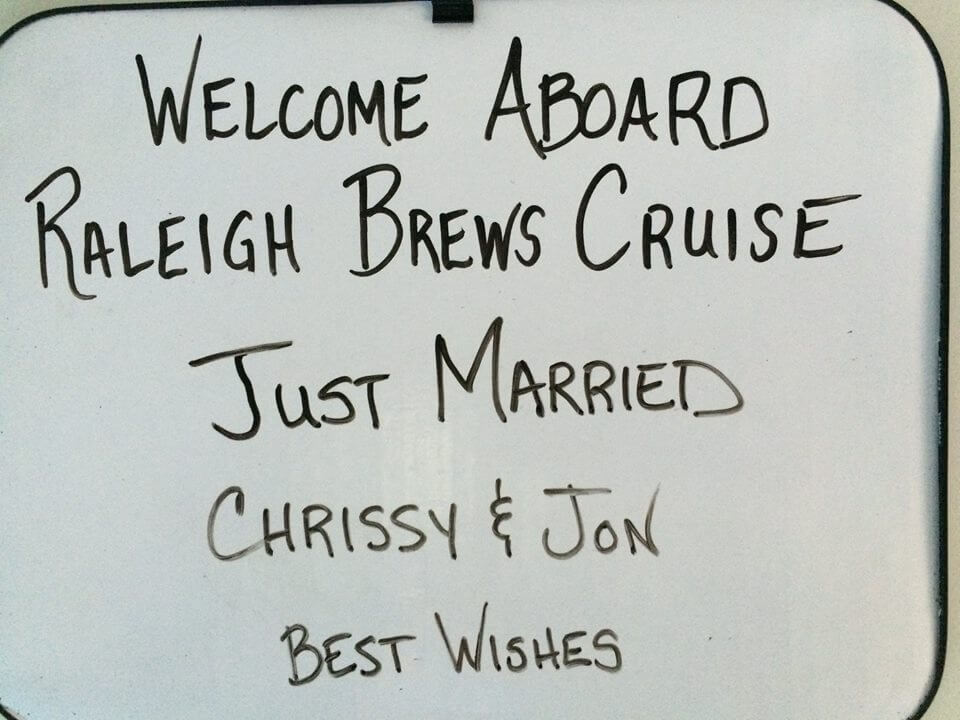 Just Married Sign Chrissy and Jon Raleigh Brews Cruise a close up of a sign