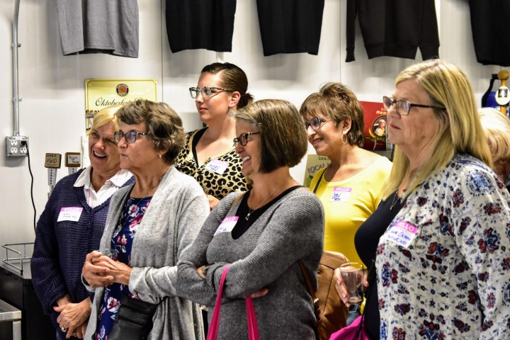 a group of people standing in a room