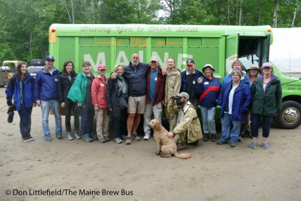 a group of people standing in front of a crowd posing for the camera