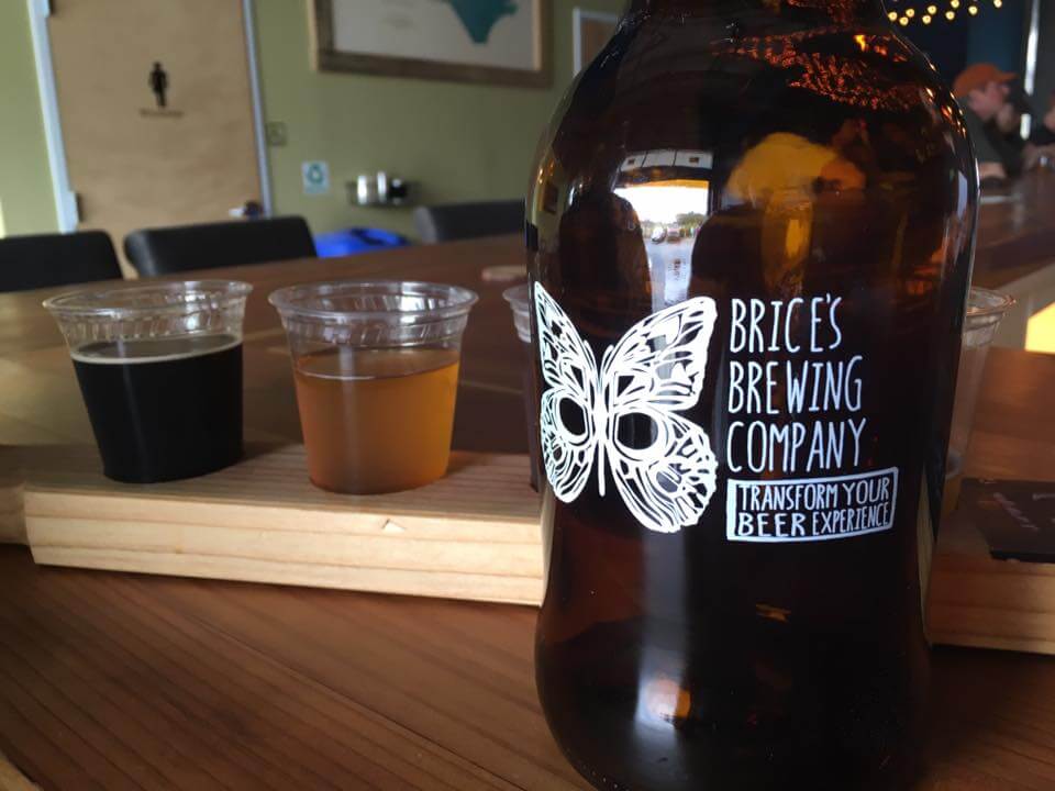 a bottle and a glass of beer on a table