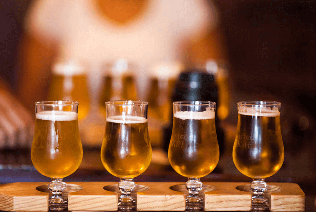 Craft-Beer-in-Glasses a glass of wine on a table