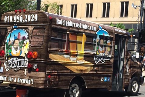 a truck is parked in front of a bus
