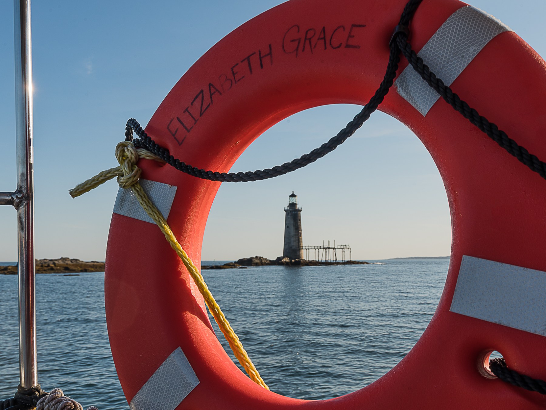 a close up of a boat next to a body of water