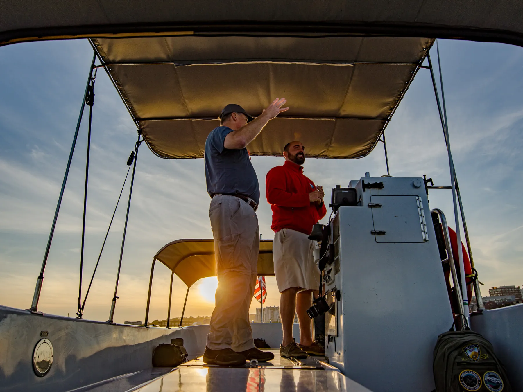 a man standing next to a boat