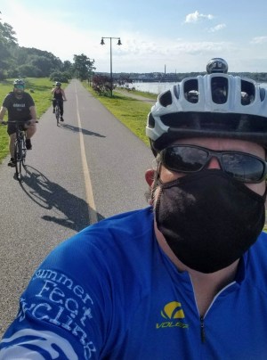 a man wearing a hat and sunglasses