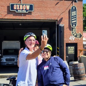 a man and a woman standing in front of a building