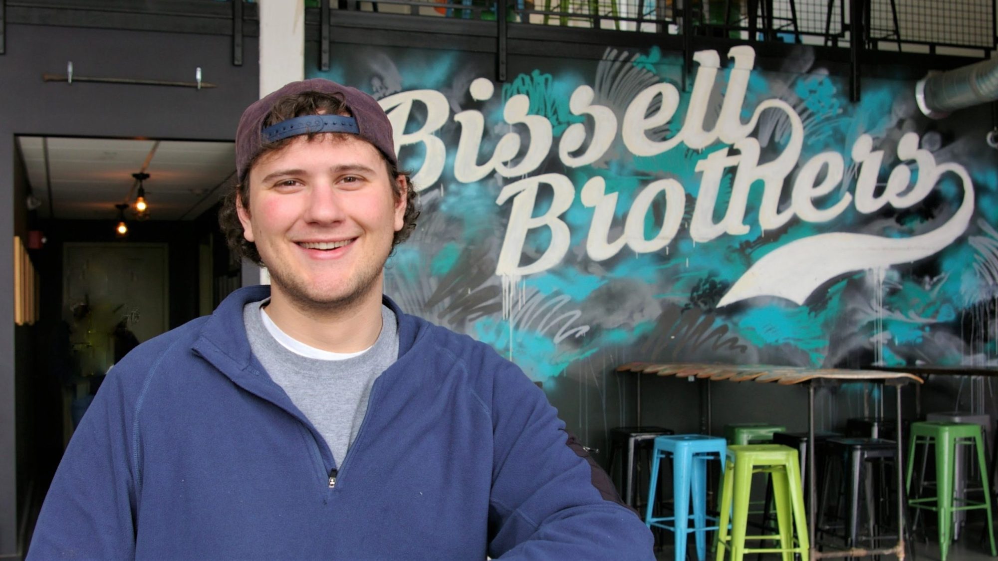 a man standing in front of a store
