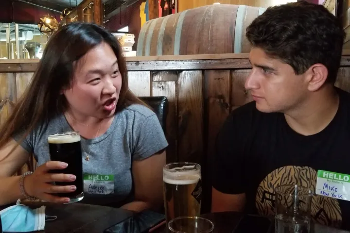 a person sitting at a table in a restaurant