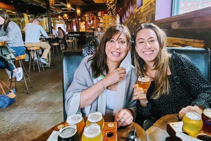 a woman sitting at a table eating food