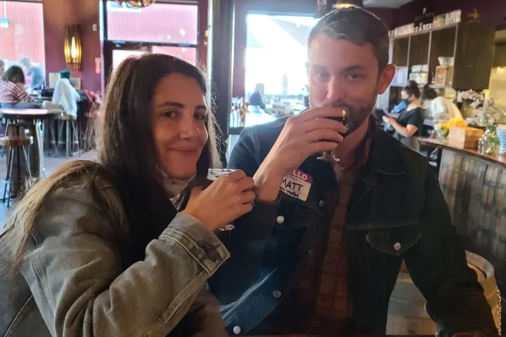 a person holding a glass of wine