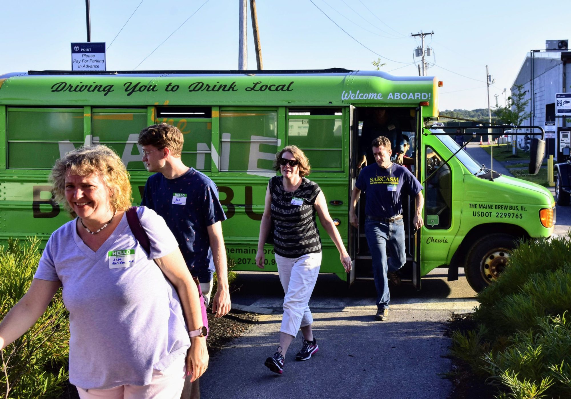 a group of people standing in a parking lot