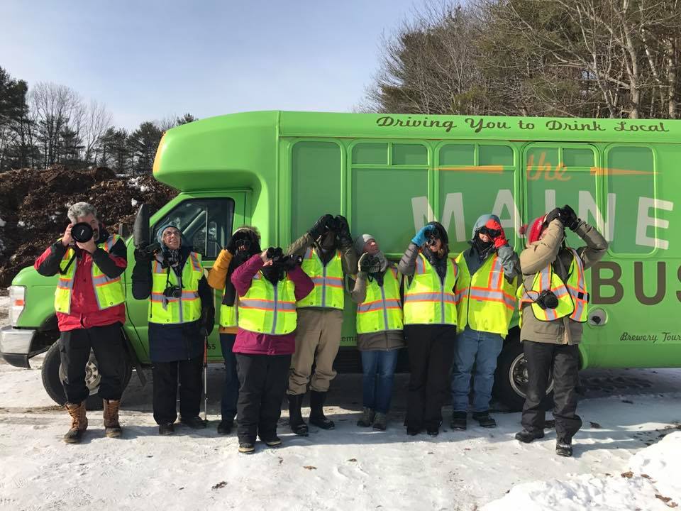50250732_2562275990465590_2733032469497380864_n a group of people standing in front of a bus