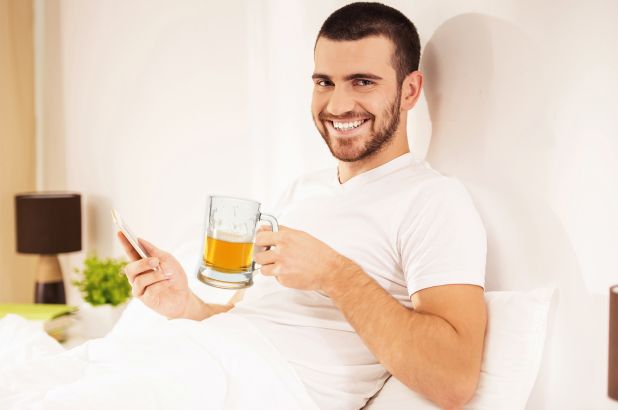 health benefits of beer a man sitting at a table