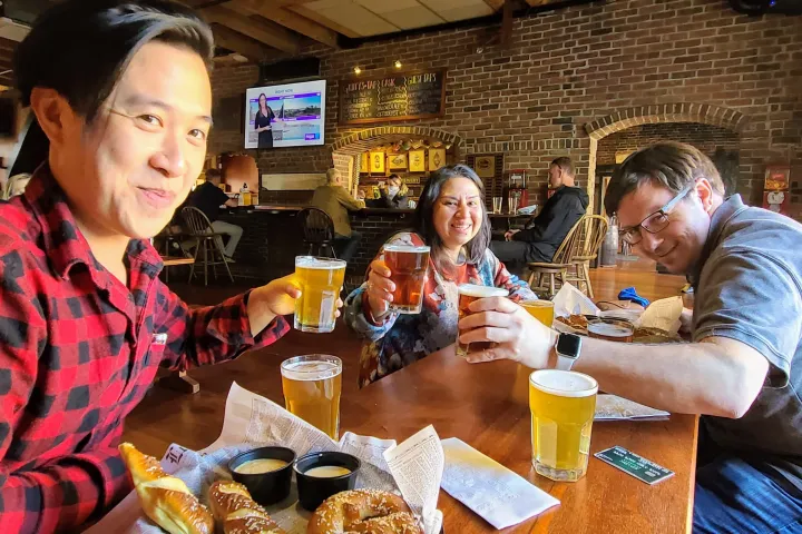 a group of people sitting at a table in a restaurant