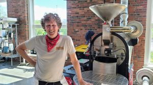 a man standing in front of a building