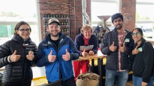 a group of people holding wine glasses