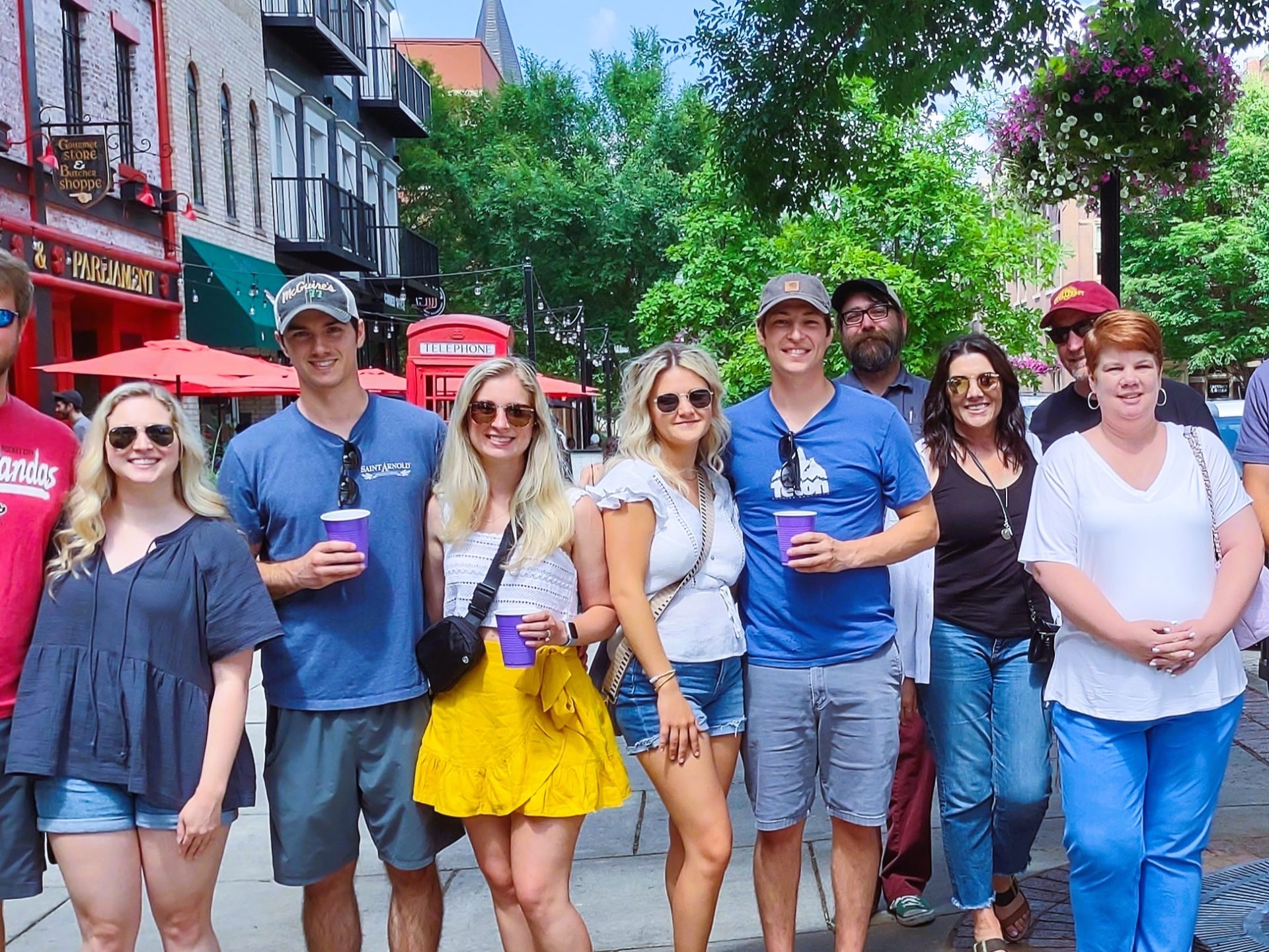 a group of people standing in front of a crowd posing for the camera