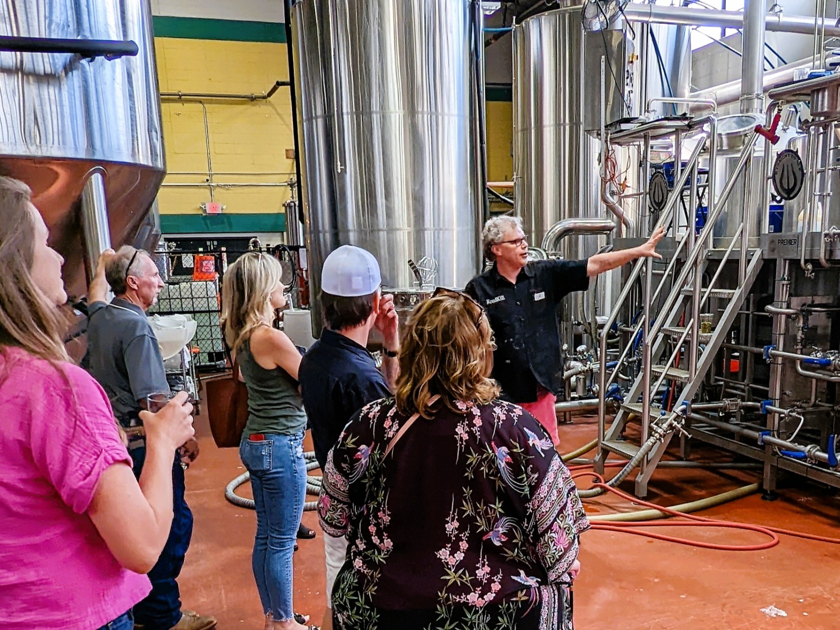 a woman standing in front of a crowd of people
