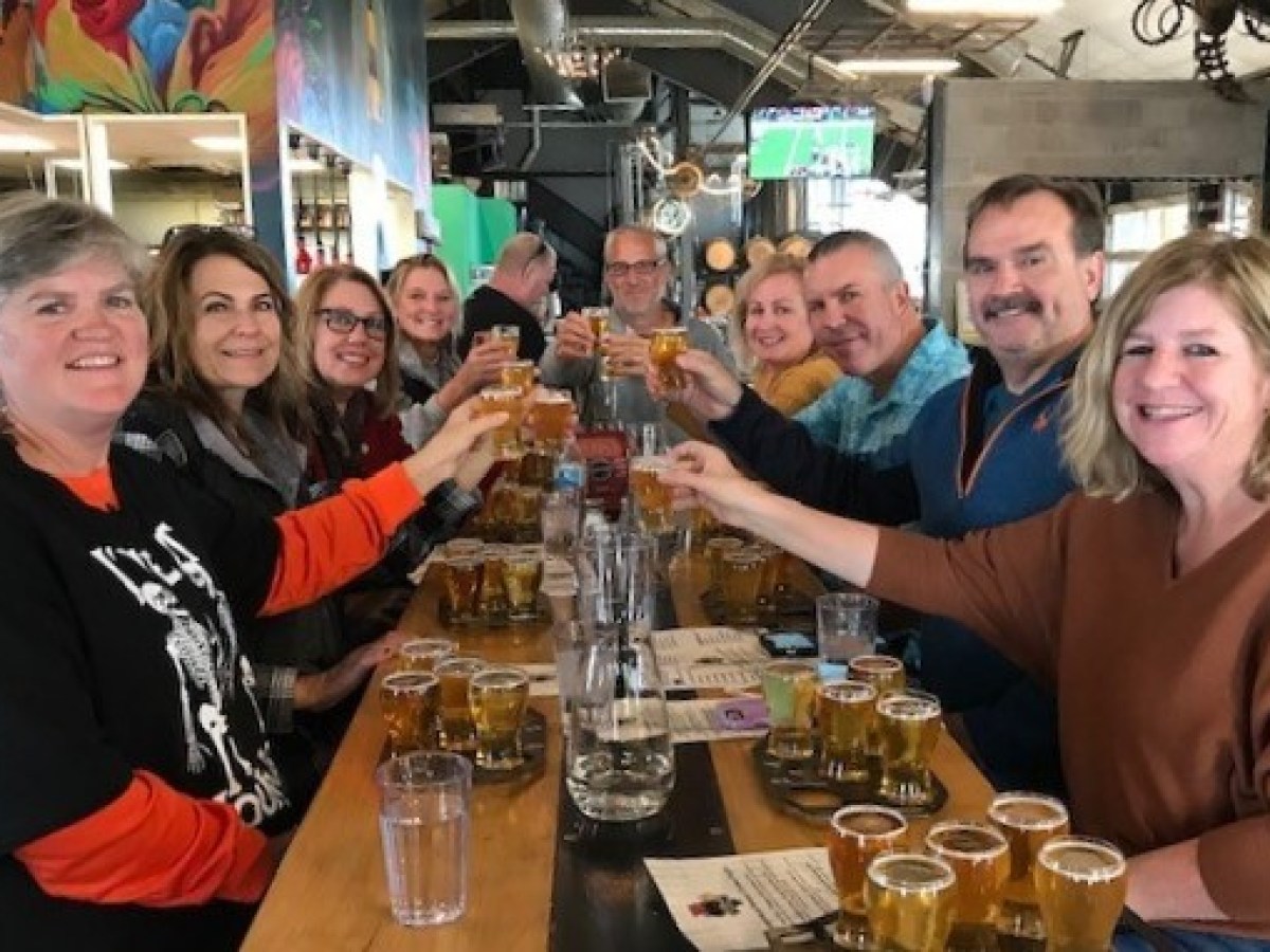 Laura Parker et al. sitting at a table posing for the camera