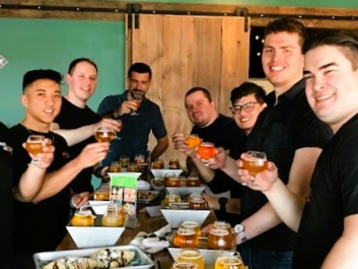 a group of people eating food at a restaurant