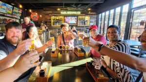 a group of people sitting at a table in a restaurant