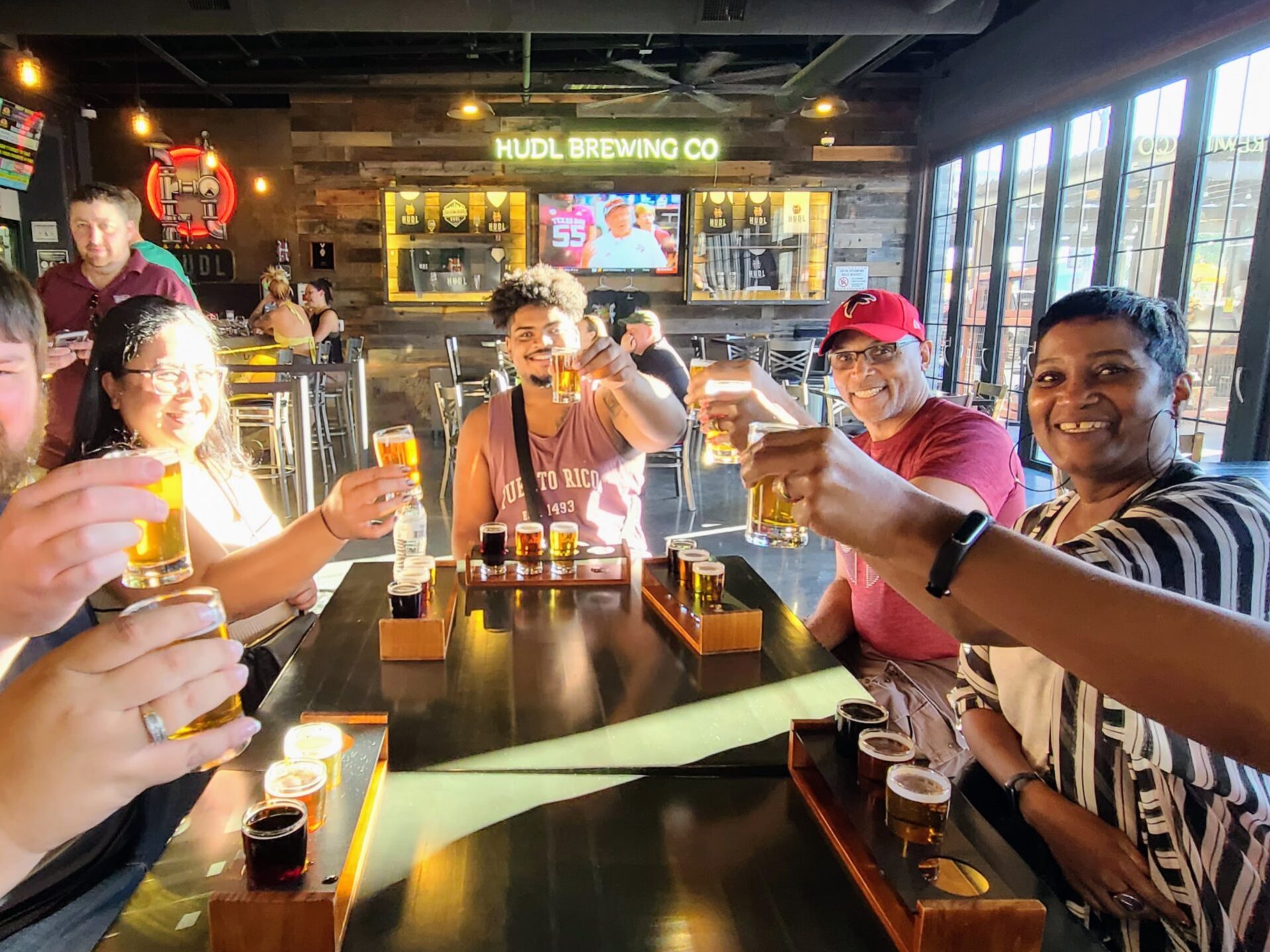 a group of people sitting at a table in a restaurant