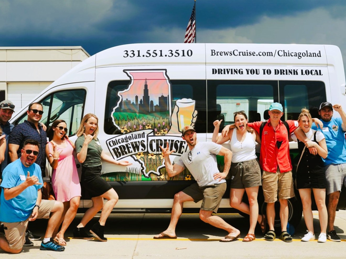 a group of people standing in front of a bus