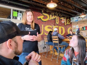 a group of people sitting at a table in a restaurant