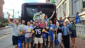 a group of people standing in front of a crowd posing for the camera