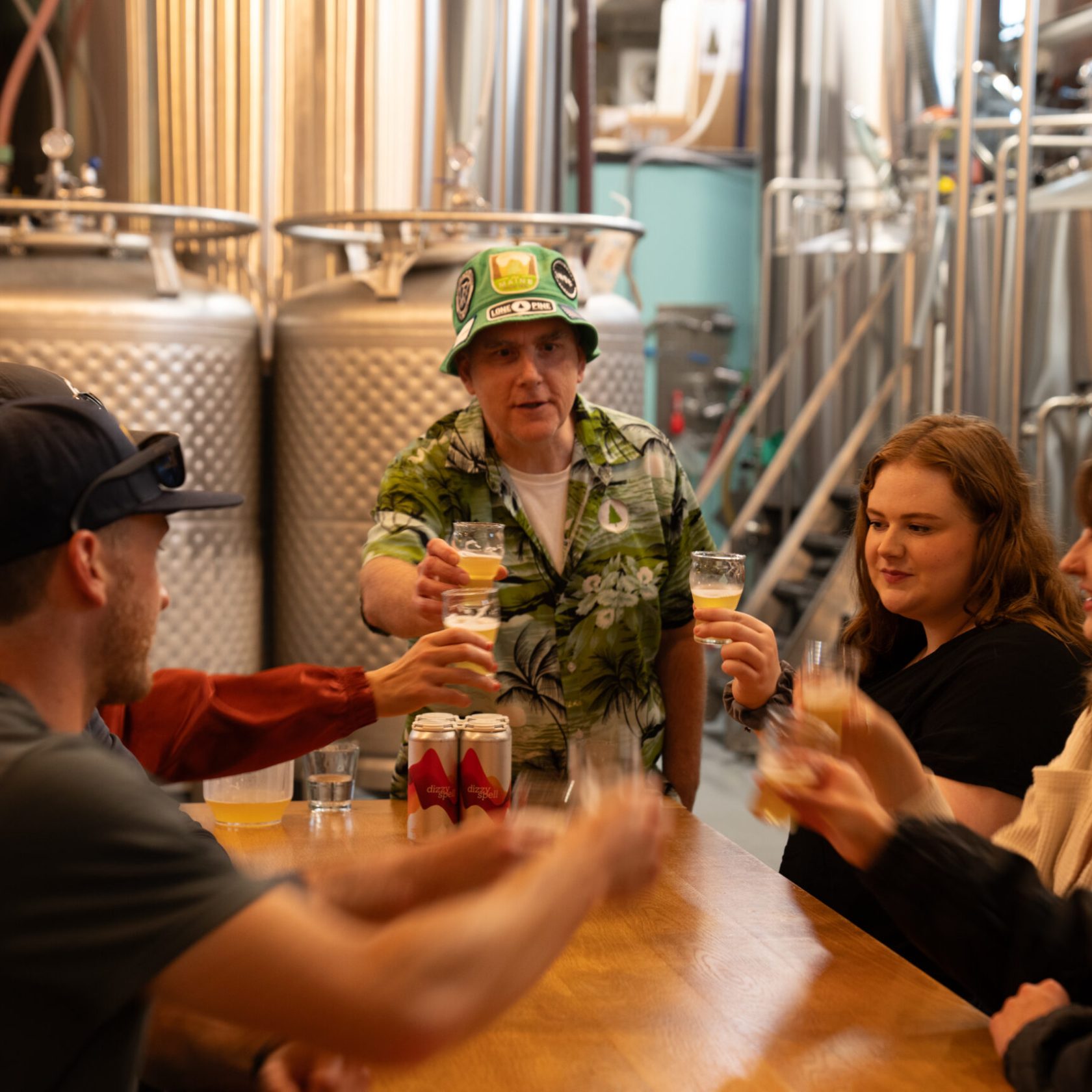 a group of people sitting at a table with wine glasses