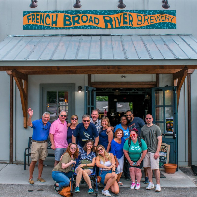 a group of people standing in front of a building