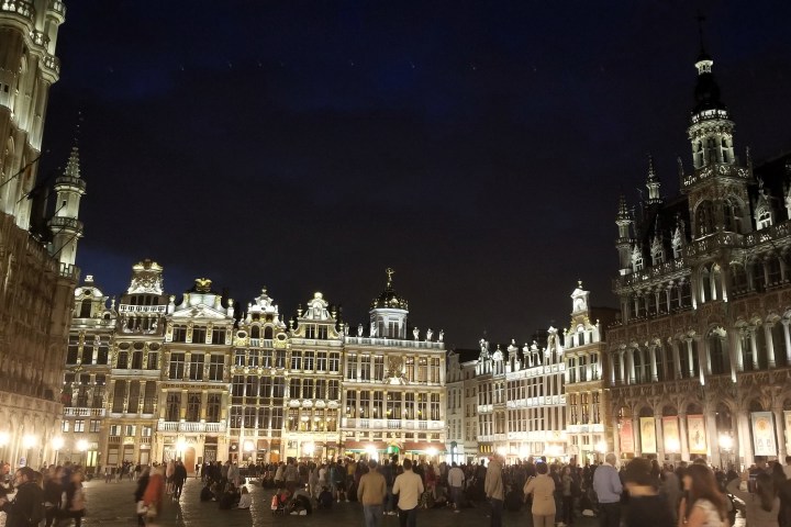 a crowd of people standing in front of Grand Place