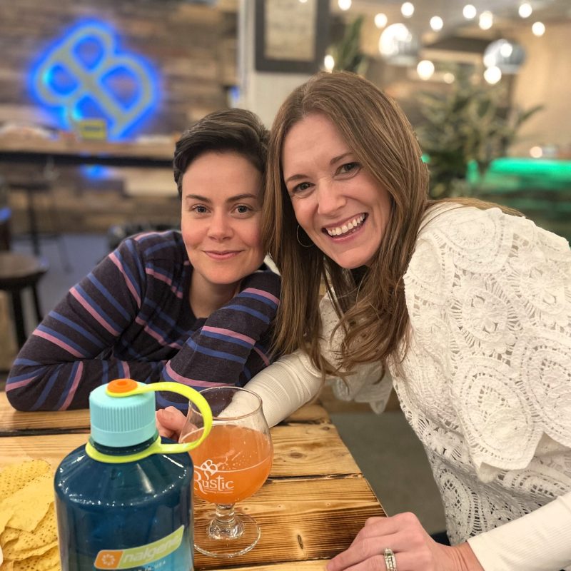 a man and a woman sitting on a table