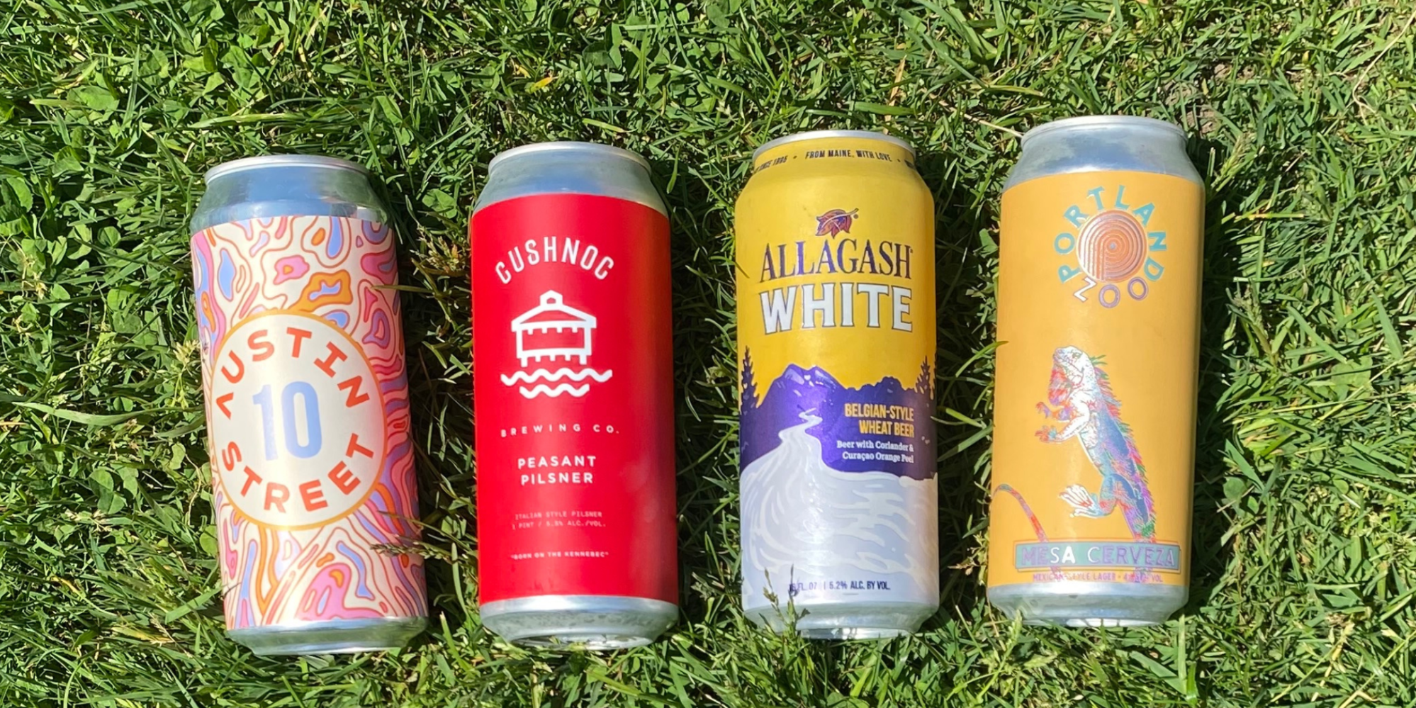 MBC – June Blog Four Cans of Maine Crafft Beer on the lawn of Boothby Square